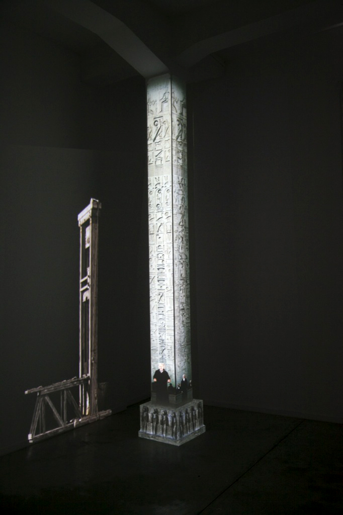"Detail no. 1 from the  Museum of Displaced Monuments: Luxor Obelisk", 
2014,
two-channel video installation projected on a wall and a column,  
color, 
stereo sound,
duration 3:20 min,
dimantions variable