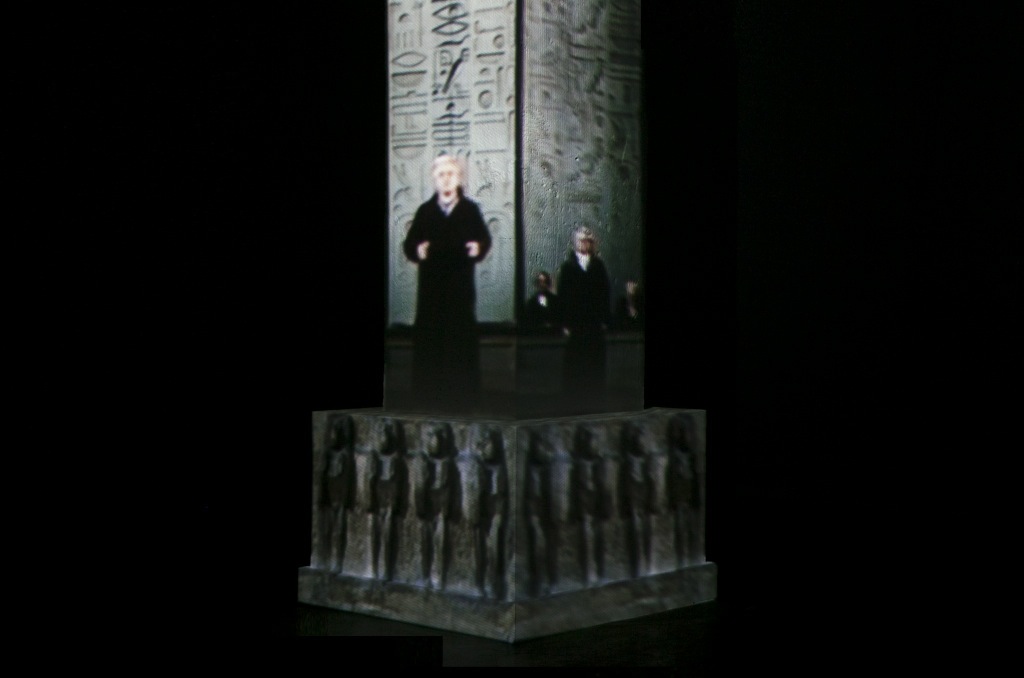 "Detail no. 1 from the  Museum of Displaced Monuments: Luxor Obelisk", 
2014,
two-channel video installation projected on a wall and a column, color, stereo sound, duration 3:20 min, dimantions variable