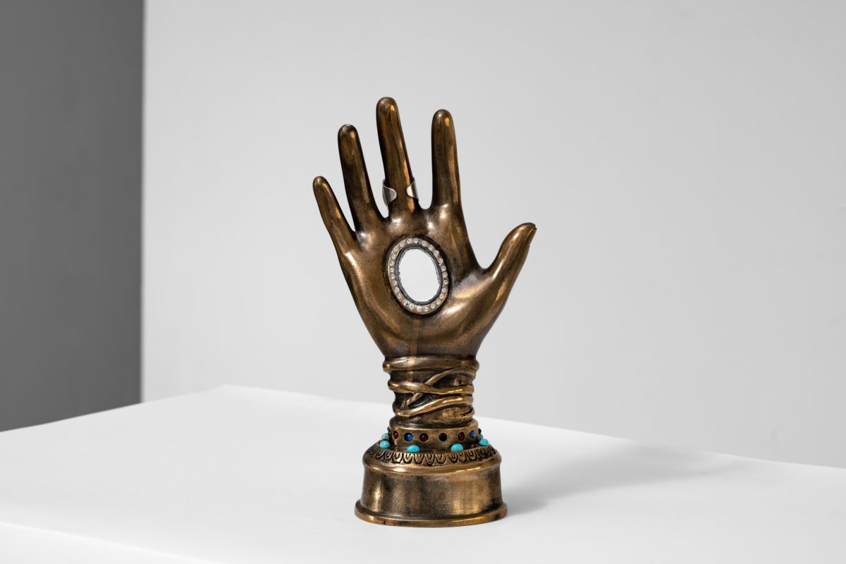 Elena Ceretti Stein, Hand of Saint, 2022, Bronze, glass, mirror, metal jewelry, amber crystal, acrylic, 27 x 14 x 8 cm. Photo by Daniel Hanoch